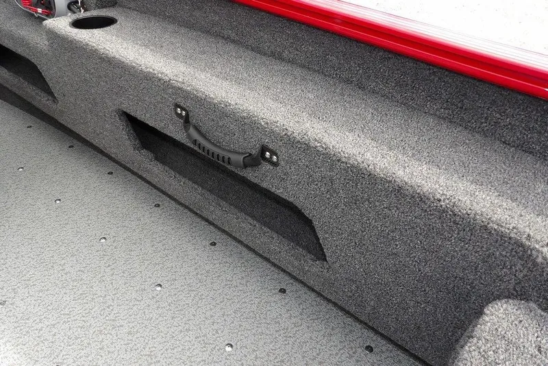 Slide: The Image of Interior of 2026 Lund 1775 Adventure Sport boat, featuring gray carpeted storage area. - 19