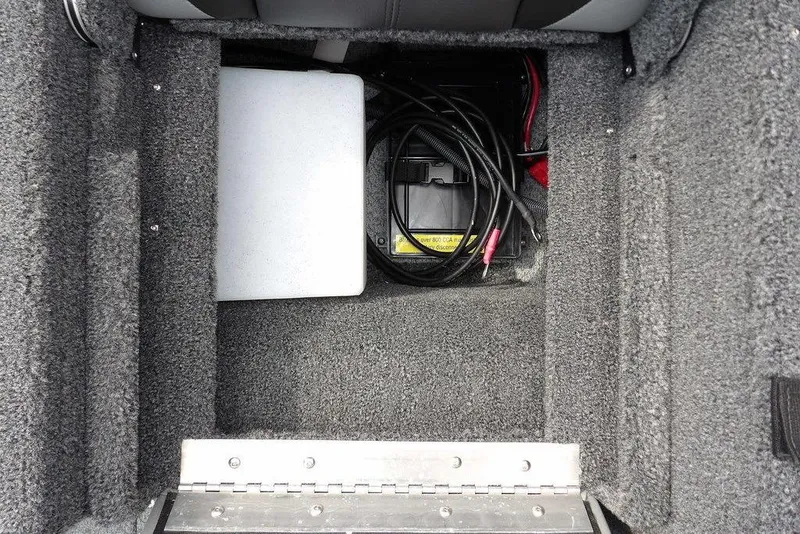 Slide: The Image of 2026 Lund 1775 Adventure Sport boat storage compartment with battery and cables. - 20