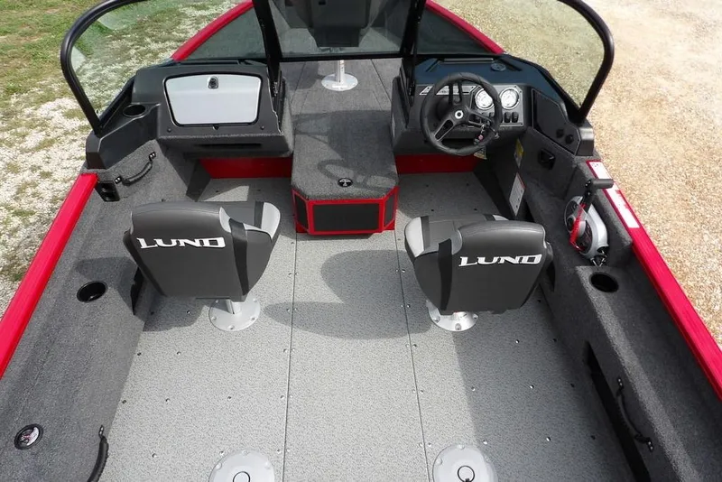 Slide: The Image of 2026 Lund 1775 Adventure Sport boat interior with dual seats and steering console. - 23