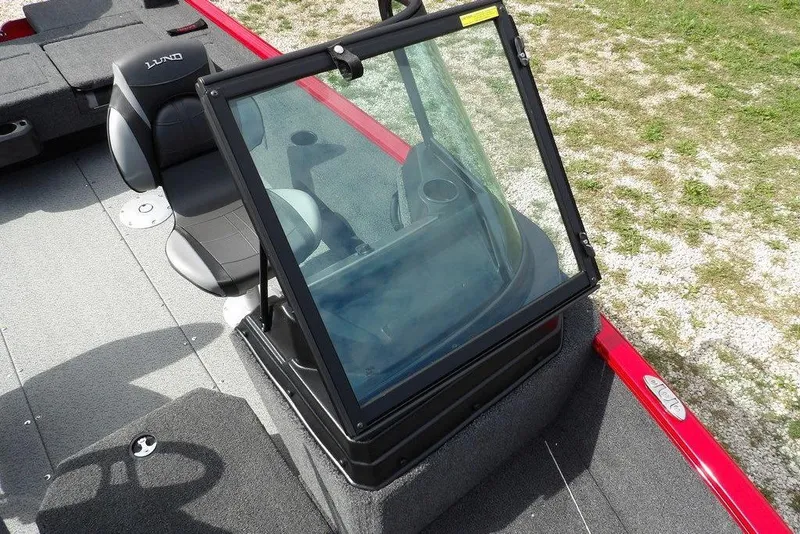 Slide: The Image of 2026 Lund 1775 Adventure Sport boat interior with windshield and seating. - 37