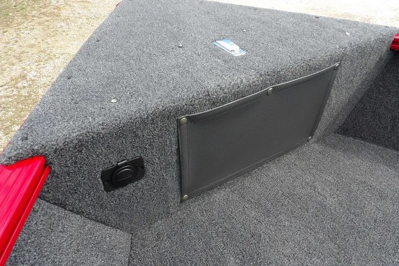Slide: The Image of Interior of 2026 Lund 1775 Adventure Sport boat with gray carpet and storage pocket. - 43