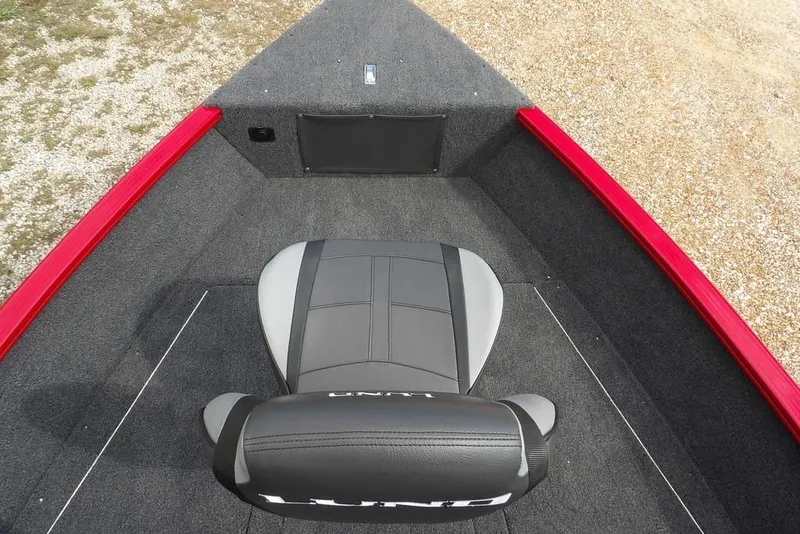 Slide: The Image of 2026 Lund 1775 Adventure Sport boat interior with gray seat and red trim. - 44