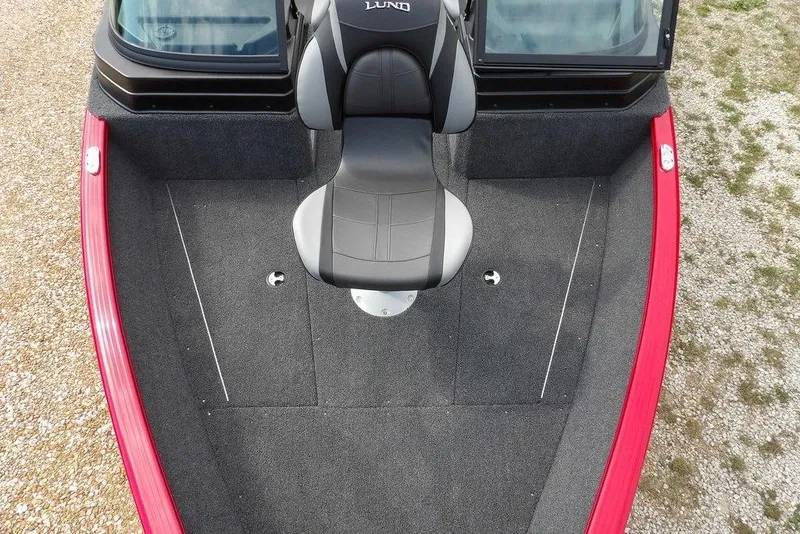 Slide: The Image of 2026 Lund 1775 Adventure Sport boat interior with red trim and seating. - 45