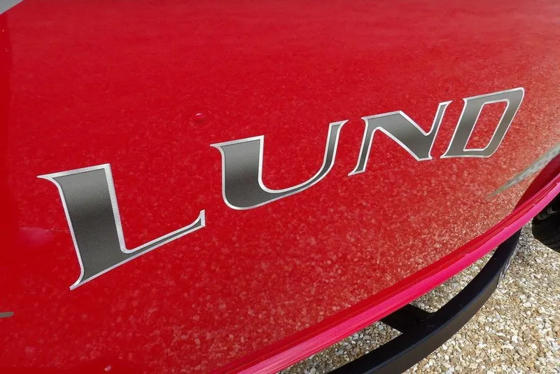 Slide: The Image of Red 2026 Lund 1775 Adventure Sport boat with bold logo. - 51