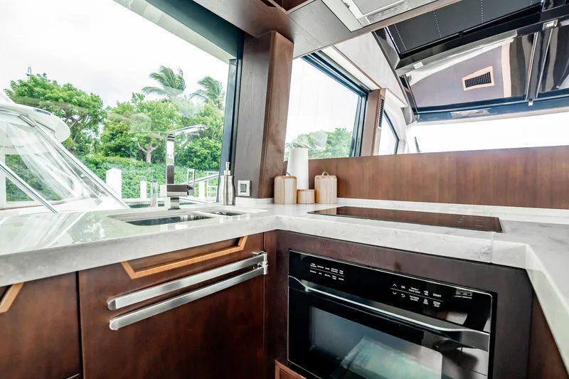 Slide: The Image of Luxurious kitchen interior of 2017 Galeon 510 Sky yacht with modern appliances and sleek design. - 12