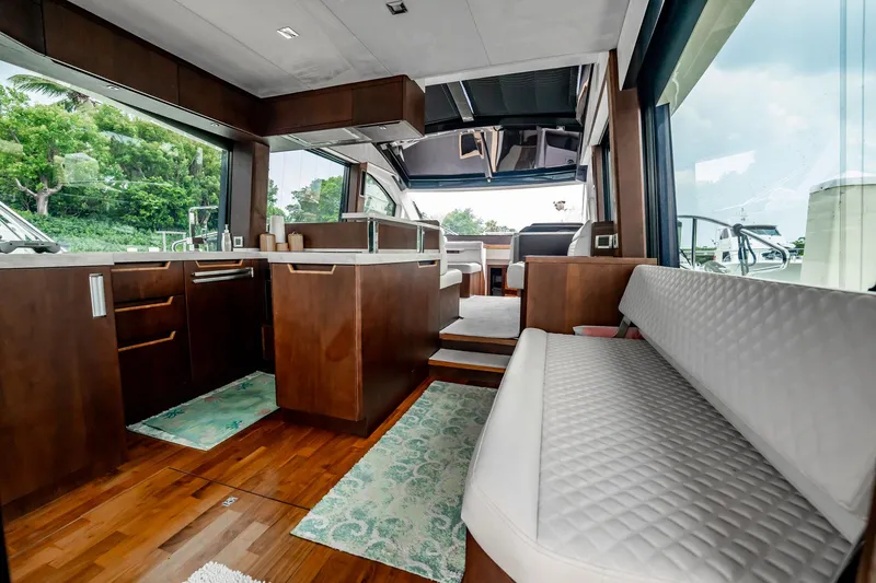 Slide: The Image of Luxurious interior of 2017 Galeon 510 Sky yacht with modern kitchen and seating area. - 15