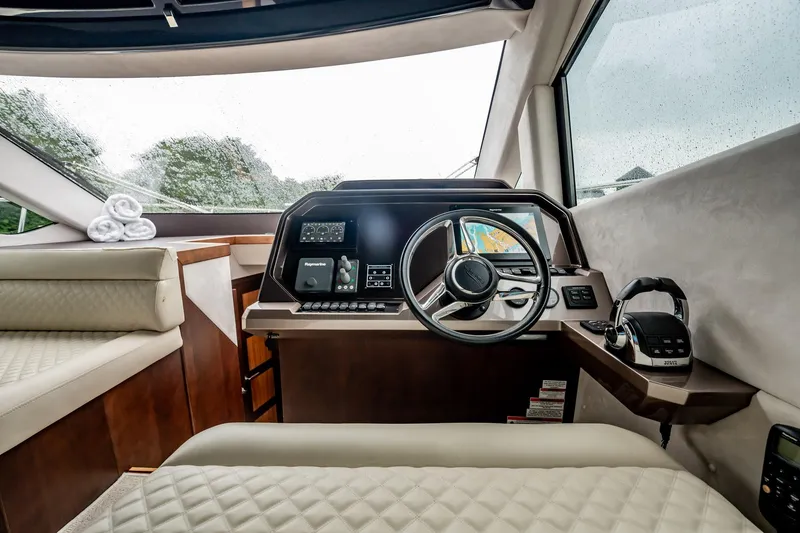 Slide: The Image of Luxurious 2017 Galeon 510 Sky yacht interior with modern helm and plush seating. - 18