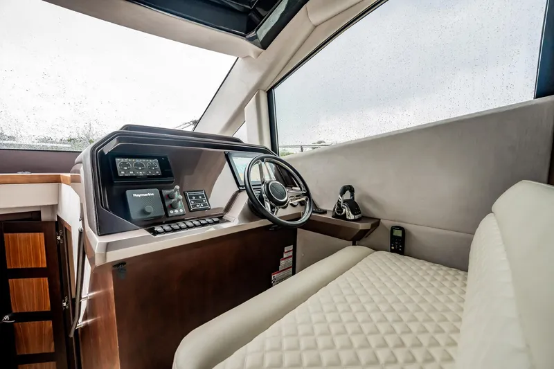 Slide: The Image of Interior helm of 2017 Galeon 510 Sky yacht with modern controls and steering wheel. - 19