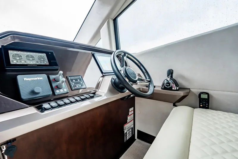 Slide: The Image of Interior helm of 2017 Galeon 510 Sky yacht with modern controls and steering wheel. - 20