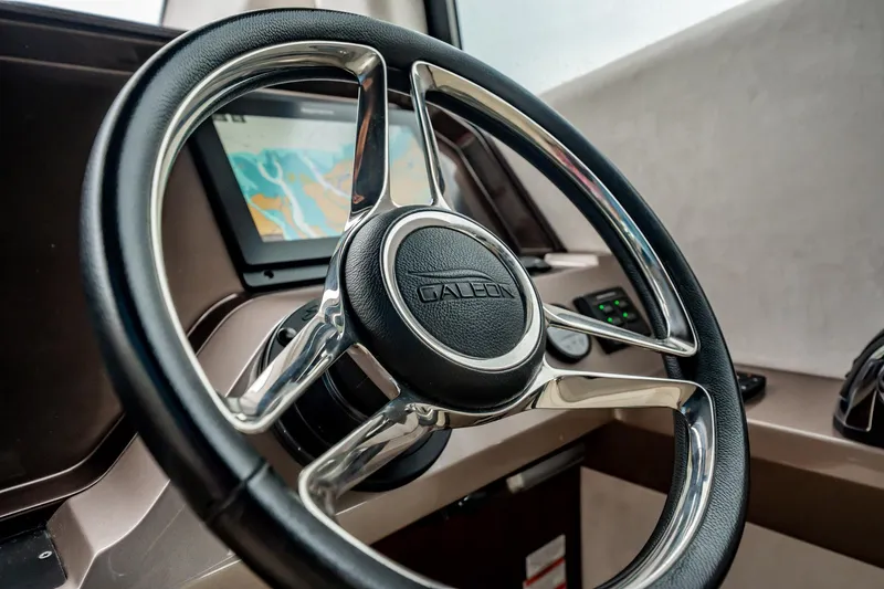 Slide: The Image of Steering wheel of 2017 Galeon 510 Sky yacht with navigation display. - 22