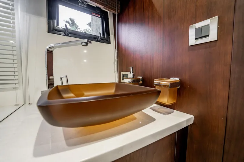 Slide: The Image of Luxurious bathroom sink on 2017 Galeon 510 Sky yacht, featuring modern design and wood accents. - 34