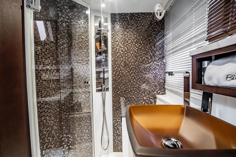 Slide: The Image of Luxurious bathroom in 2017 Galeon 510 Sky yacht with mosaic tiles and modern fixtures. - 46