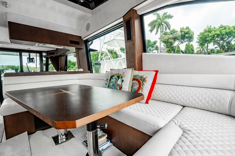 Slide: The Image of Luxurious interior of 2017 Galeon 510 Sky yacht with elegant seating and wooden table. - 8