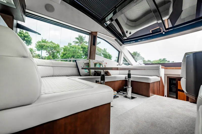 Slide: The Image of Luxurious interior of 2017 Galeon 510 Sky yacht with plush seating and panoramic windows. - 9