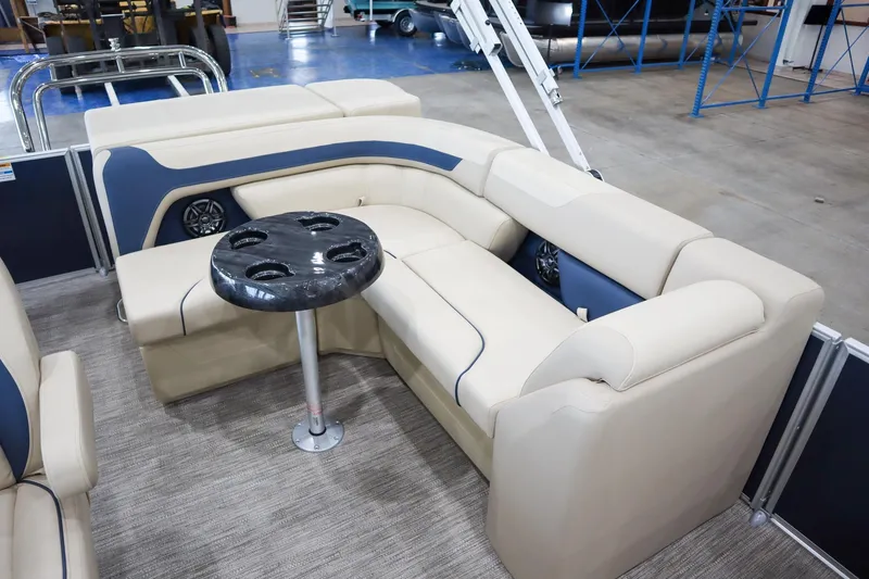Slide: The Image of Luxurious seating area on 2026 Godfrey Sweetwater 2286 C Tritoon, featuring plush beige upholstery. - 10