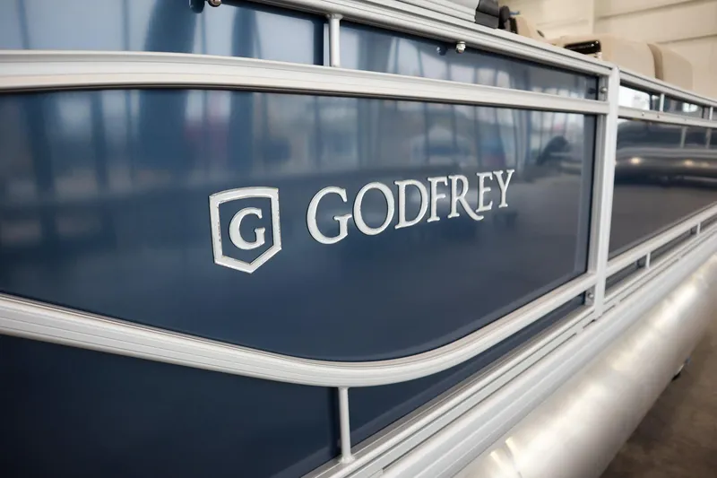 Slide: The Image of 2026 Godfrey Sweetwater 2286 C Tritoon boat, close-up of logo and design. - 13