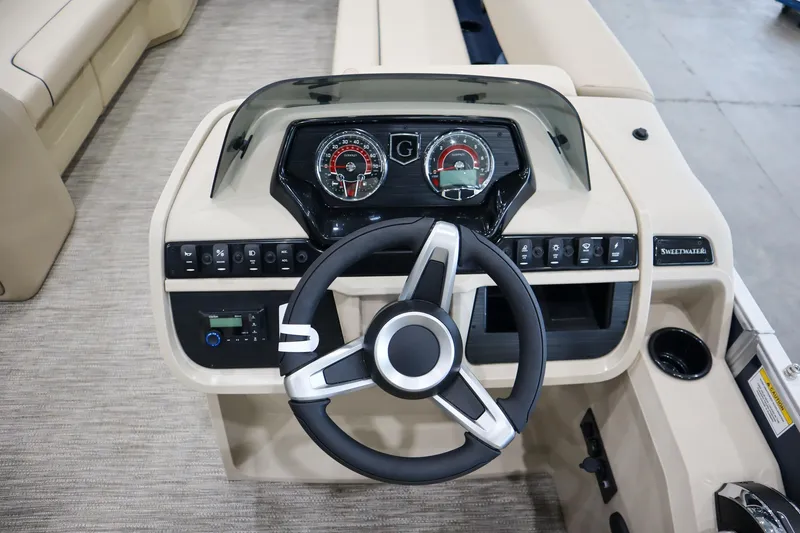 Slide: The Image of Steering console of 2026 Godfrey Sweetwater 2286 C Tritoon with modern controls and gauges. - 9