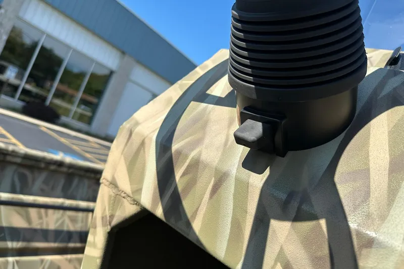 Slide: The Image of Close-up of 2026 Lowe Roughneck 2070CC boat detail with camouflage pattern. - 20