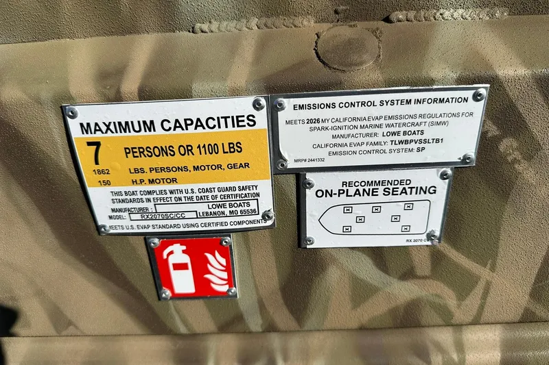 Slide: The Image of Lowe Roughneck 2070CC 2026 boat capacity and emissions information labels. - 22