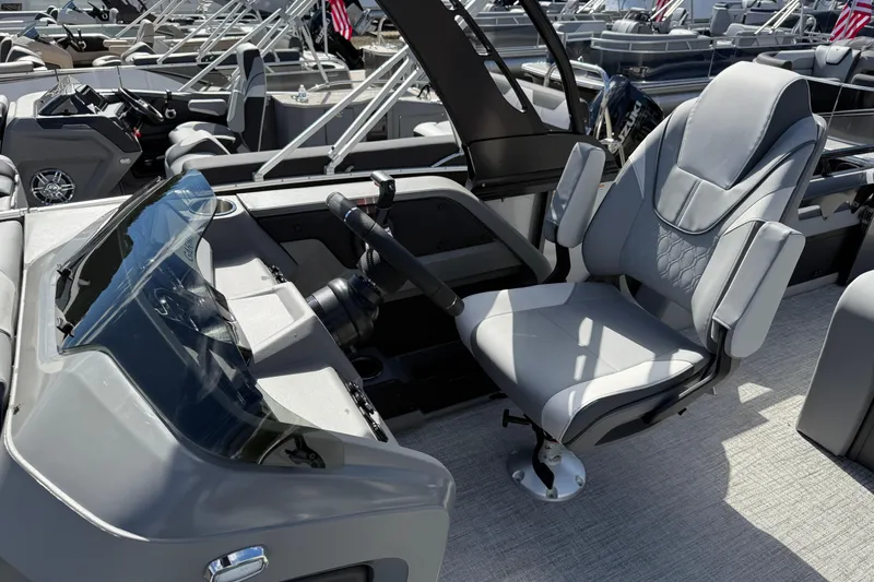 Slide: The Image of 2026 Tahoe Pontoon LTZ Versatile Rear Lounger with modern helm and comfortable seating. - 13