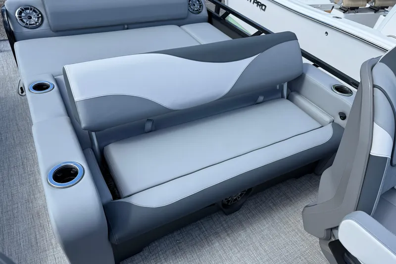 Slide: The Image of 2026 Tahoe Pontoon LTZ Versatile Rear Lounger with gray seating and cup holders. - 4