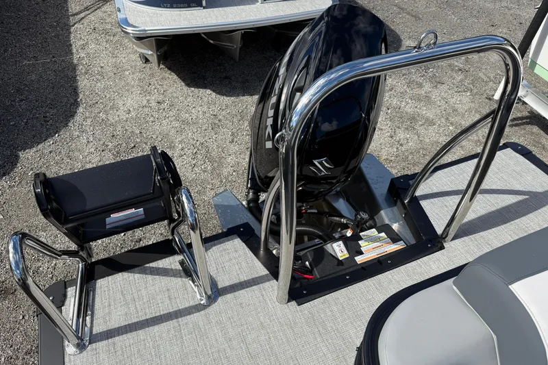 Slide: The Image of 2026 Tahoe Pontoon LTZ Versatile Rear Lounger with Suzuki outboard motor and swim ladder. - 8