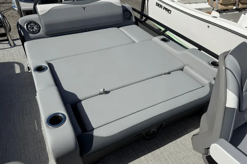 Slide: The Image of 2026 Tahoe Pontoon LTZ Versatile Rear Lounger with gray seating and cup holders. - 9