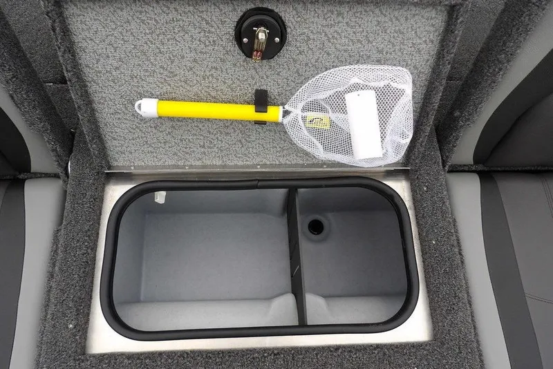 Slide: The Image of 2026 Lund 1775 Adventure SS boat storage compartment with net and yellow handle. - 15