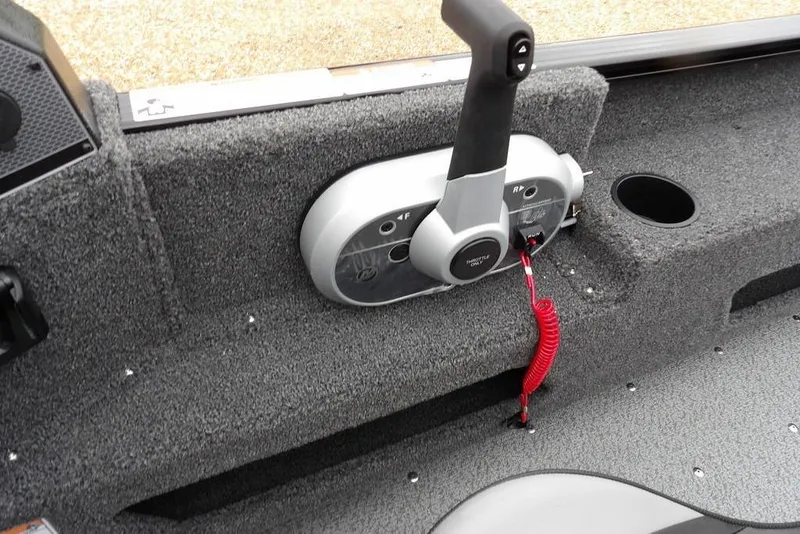 Slide: The Image of 2026 Lund 1775 Adventure SS boat throttle control with red safety cord. - 24
