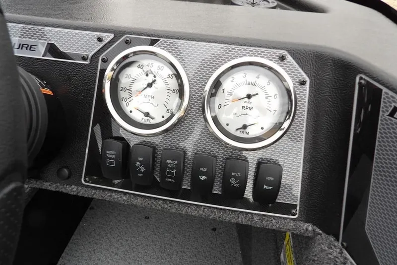 Slide: The Image of Dashboard of 2026 Lund 1775 Adventure SS boat with gauges and control switches. - 25