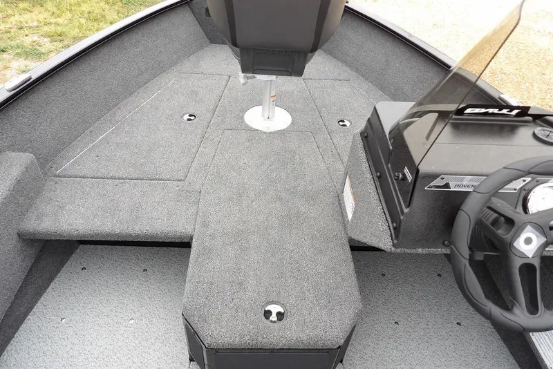 Slide: The Image of 2026 Lund 1775 Adventure SS boat interior with steering console and seating area. - 26