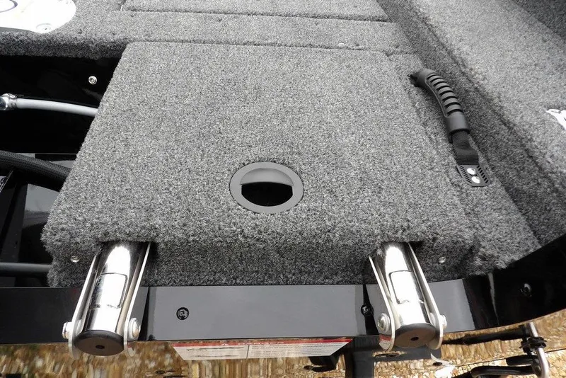 Slide: The Image of 2026 Lund 1775 Adventure SS boat deck with carpeted surface and metal fixtures. - 37