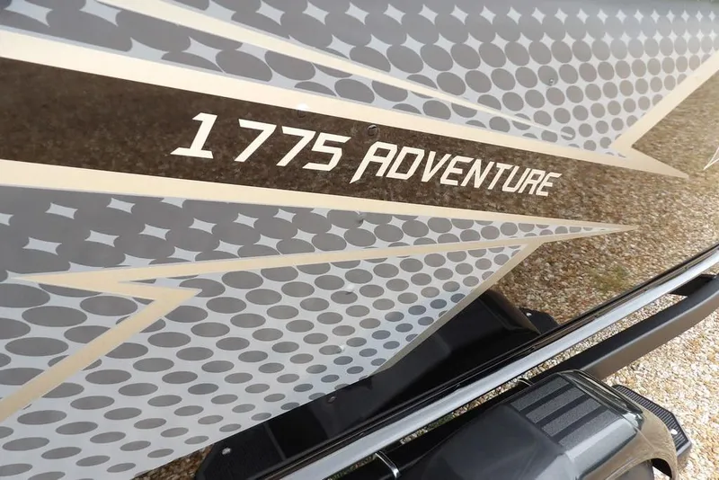 Slide: The Image of 2026 Lund 1775 Adventure SS boat with stylish graphic design on the side. - 41