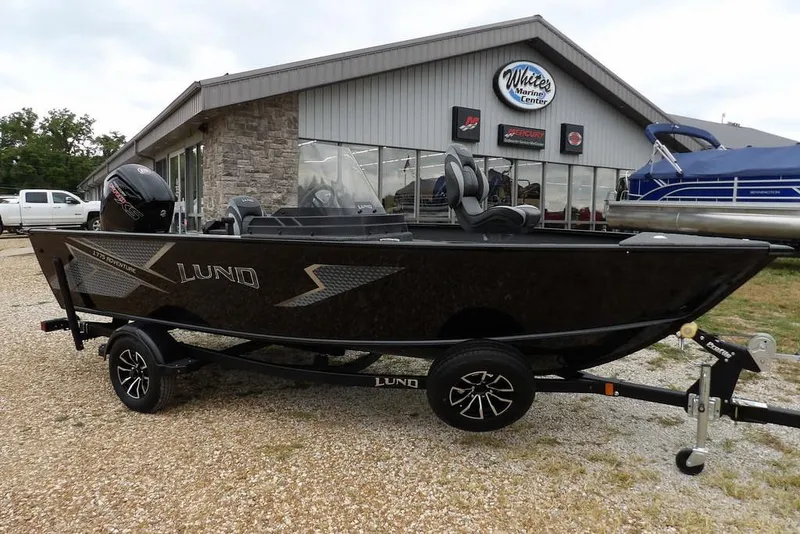 Slide: The Image of 2026 Lund 1775 Adventure SS boat on trailer outside marine center. - 5