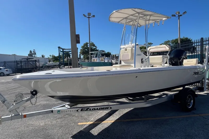 Slide: The Image of 2022 Pathfinder 2005 TRS boat on trailer in sunny outdoor setting. - 1