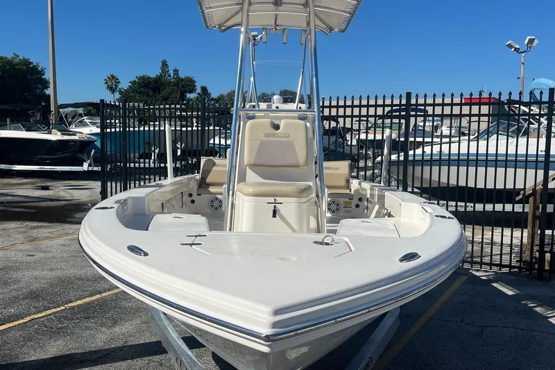 Slide: The Image of Pathfinder 2005 TRS boat, 2022 model, docked in a marina under clear blue skies. - 4