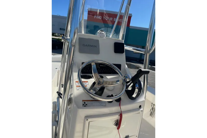 Slide: The Image of ```json { "alt_text": "Pathfinder 2005 TRS boat console with Garmin GPS, 2022 model." } ``` - 5