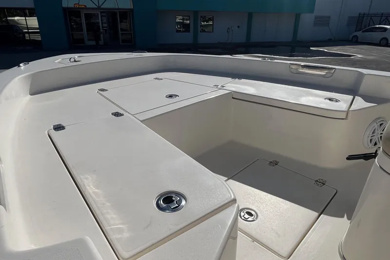 Slide: The Image of 2005 Pathfinder TRS boat interior, featuring spacious seating and storage compartments. - 7