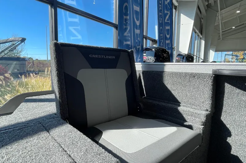 Slide: The Image of 2026 Crestliner 1650 Hawk boat seat in showroom, showcasing modern design and comfort. - 6