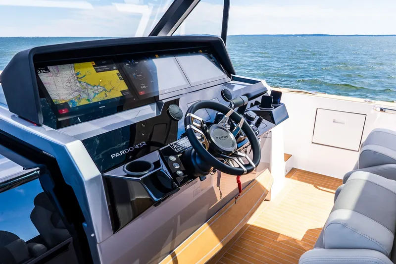 Slide: The Image of Cockpit of 2027 Pardo Yachts P43R with advanced navigation system and luxurious seating. - 52