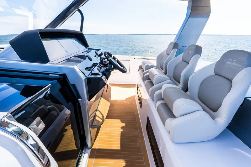 Slide: The Image of 2027 Pardo Yachts P43R cockpit with modern helm and luxurious seating on open water. - 51
