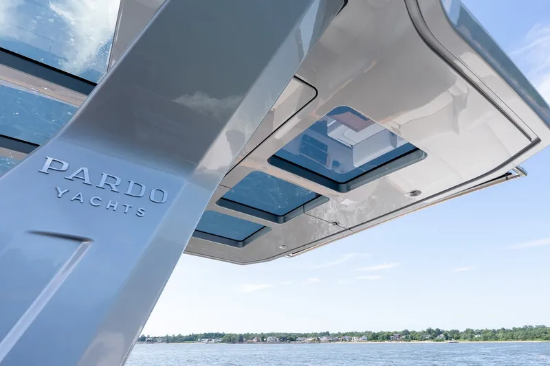 Slide: The Image of 2027 Pardo Yachts P43R with sleek design and panoramic windows on a sunny day. - 35