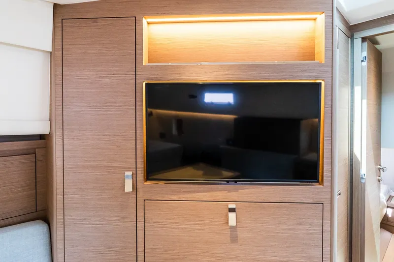 Slide: The Image of Luxurious interior of 2027 Pardo Yachts P43R featuring a sleek wall-mounted TV. - 24