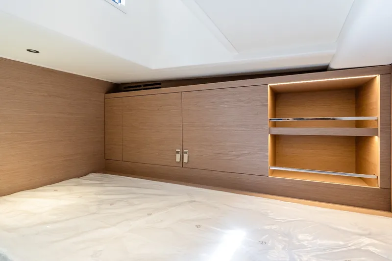 Slide: The Image of Luxurious cabin interior of 2027 Pardo Yachts P43R with sleek wood finish and shelving. - 31