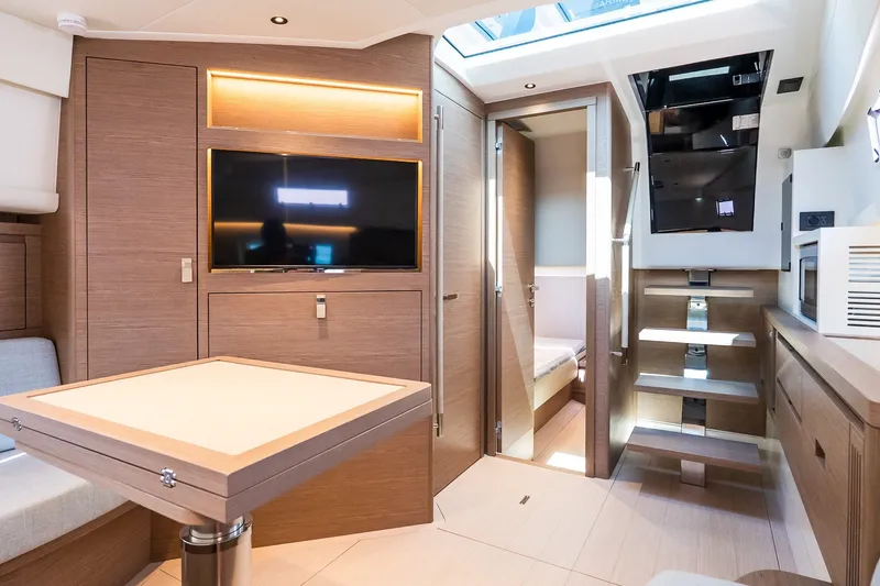 Slide: The Image of Luxurious interior of 2027 Pardo Yachts P43R with modern wood finishes and skylight. - 23