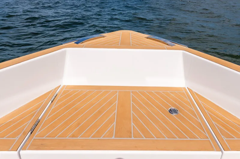 Slide: The Image of Bow view of 2027 Pardo Yachts P43R with teak deck on water. - 44