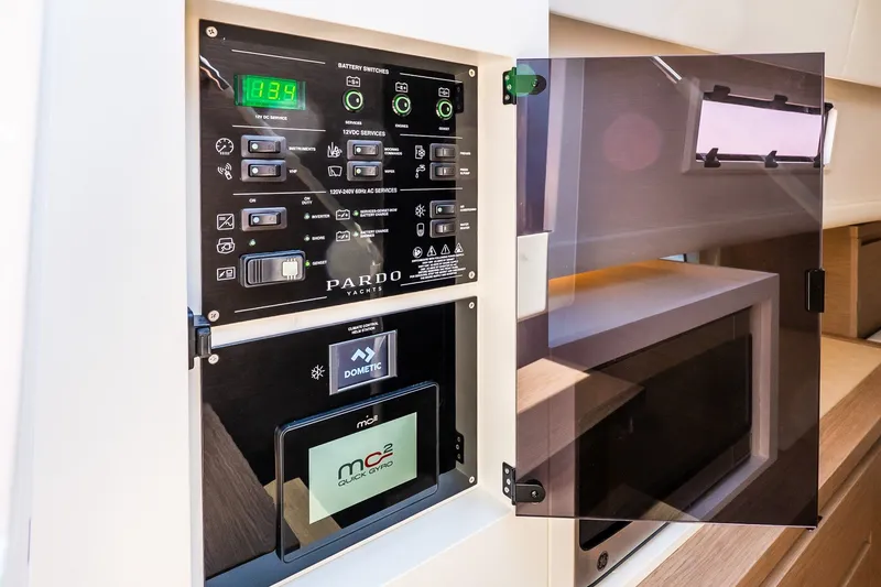 Slide: The Image of Control panel of 2027 Pardo Yachts P43R, featuring advanced electronic systems and displays. - 34