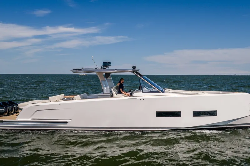 The Image of 2027 Pardo Yachts P43R cruising on open water under clear blue skies. - 0