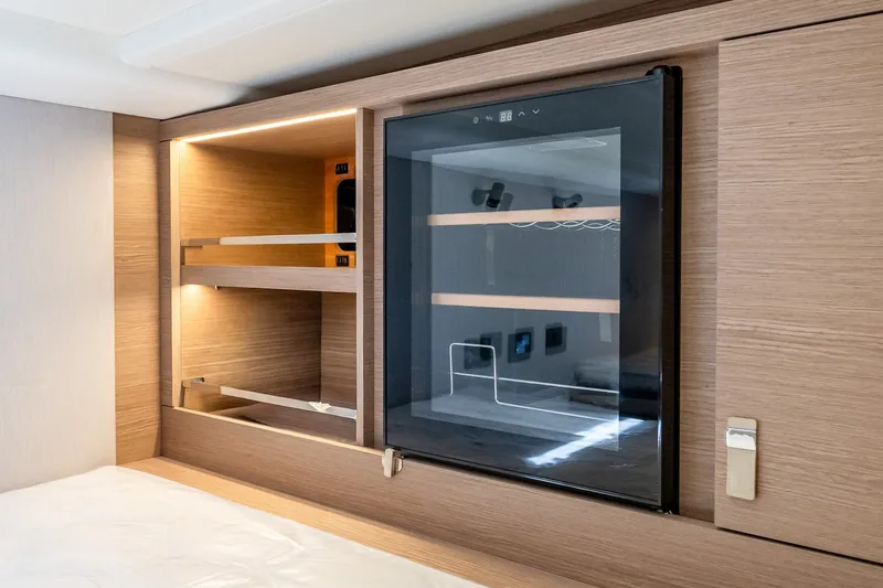 Slide: The Image of Luxurious interior of 2027 Pardo Yachts P43R, featuring sleek wooden cabinetry and modern design. - 29