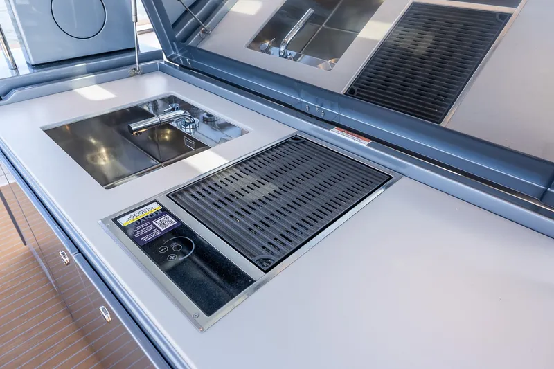 Slide: The Image of Modern kitchen area on 2027 Pardo Yachts P43R with sink and grill. - 39